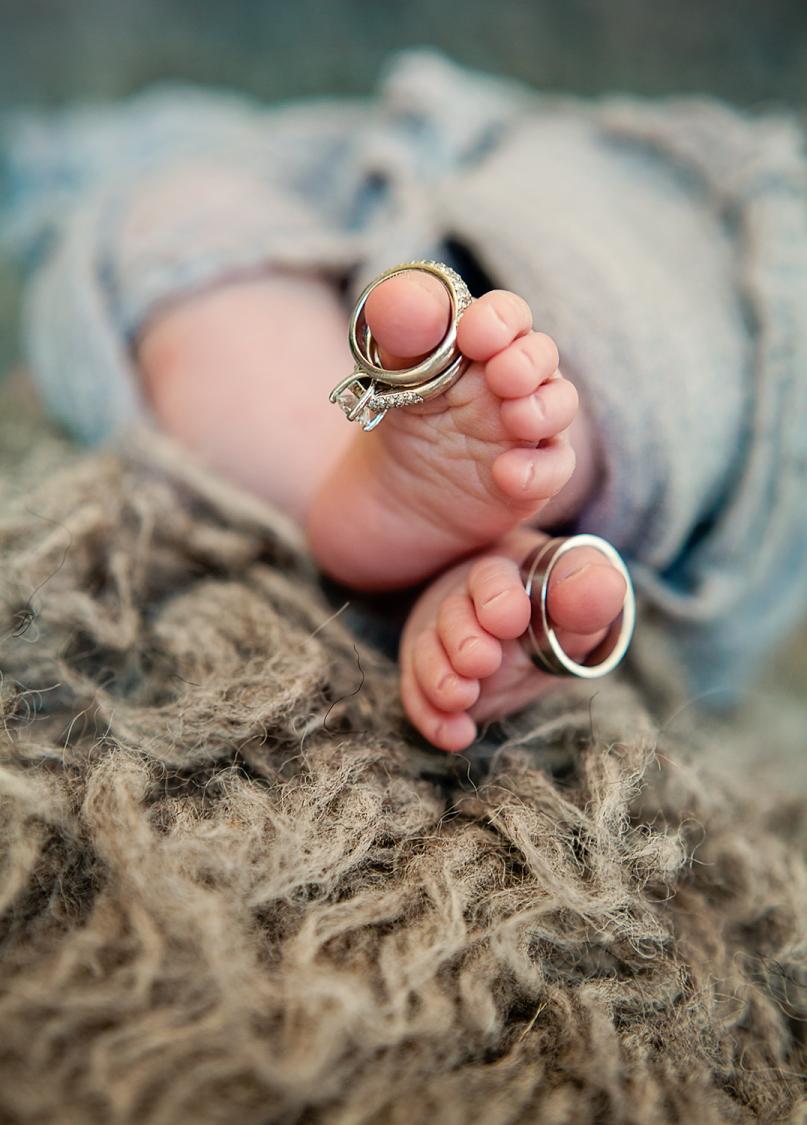 newborn toes with wedding rings